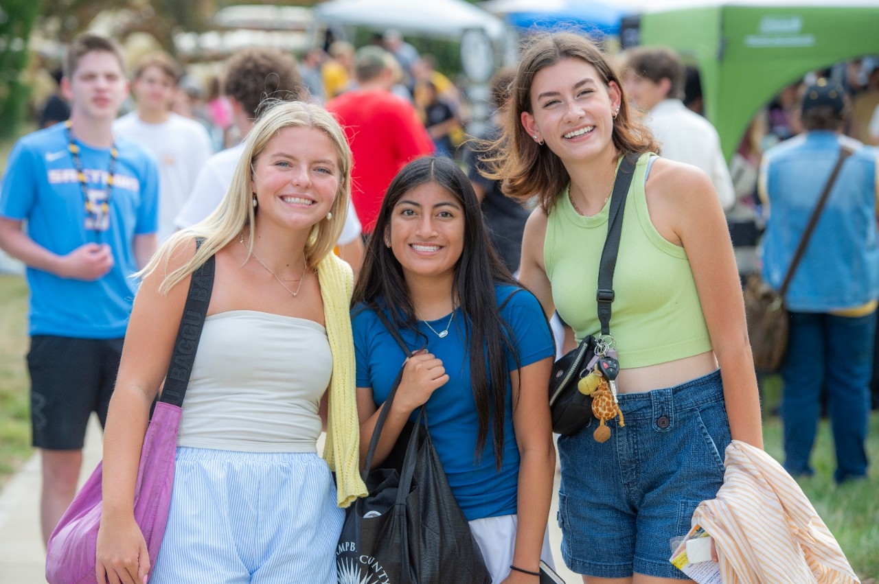 Three freshman posing together at NKU's Fresh Fusion