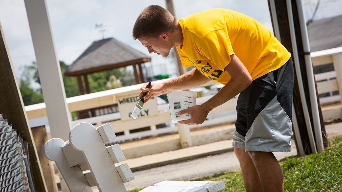 Student volunteering for service