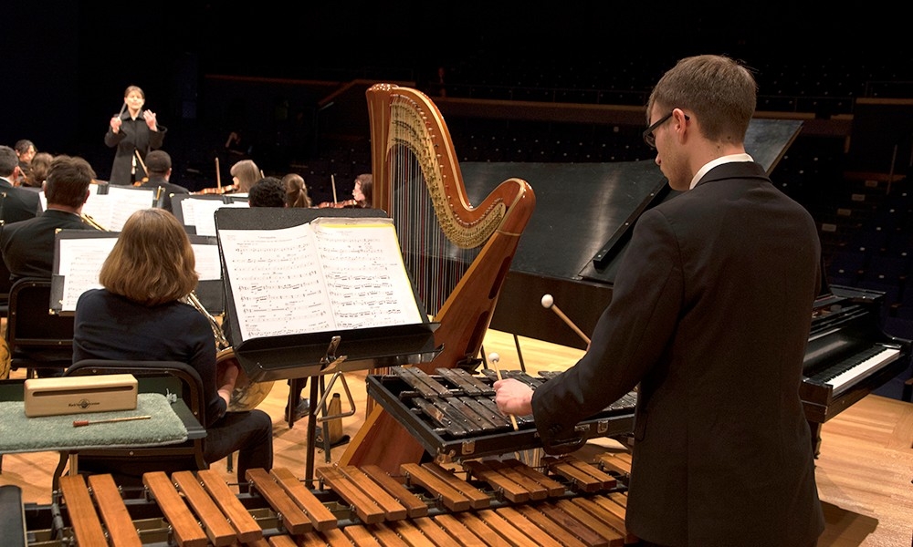 Students playing strings