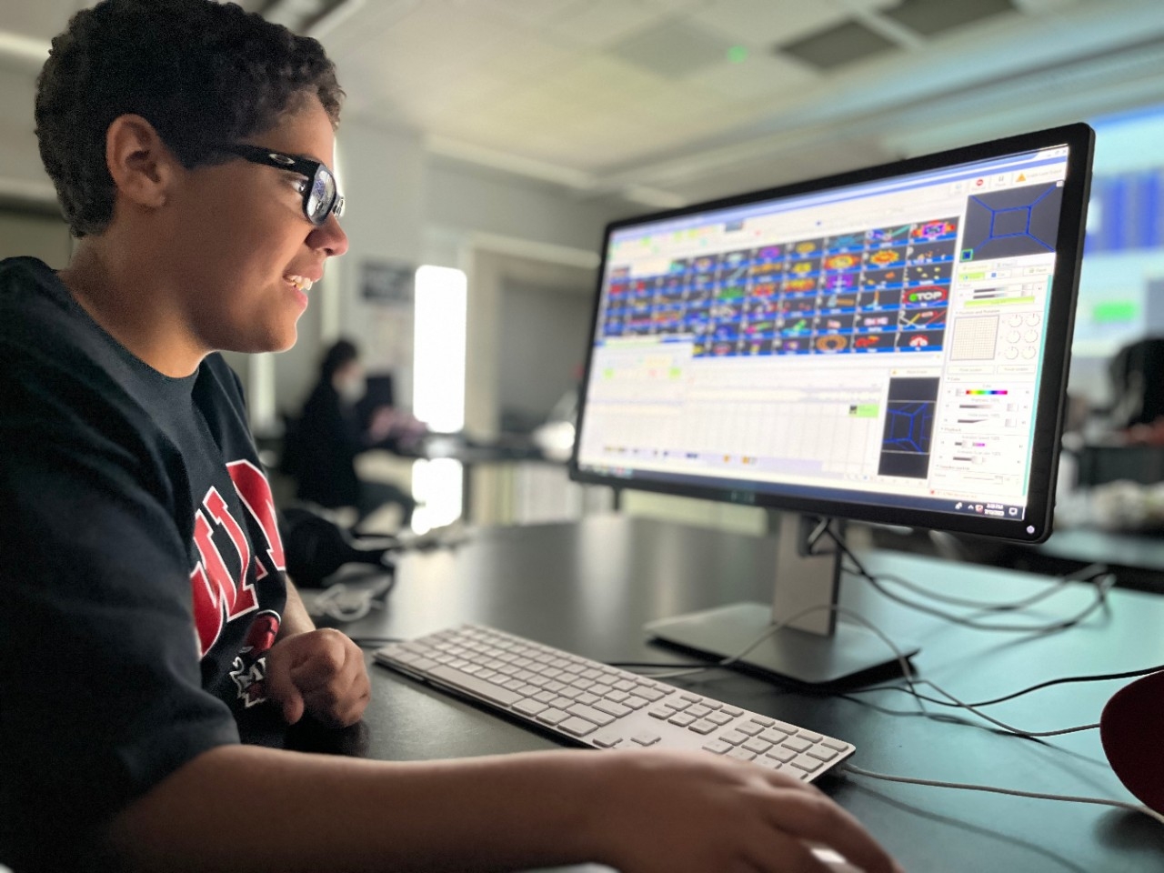 Laser Light Spectacular Camp Campers crafting custom light shows on computers