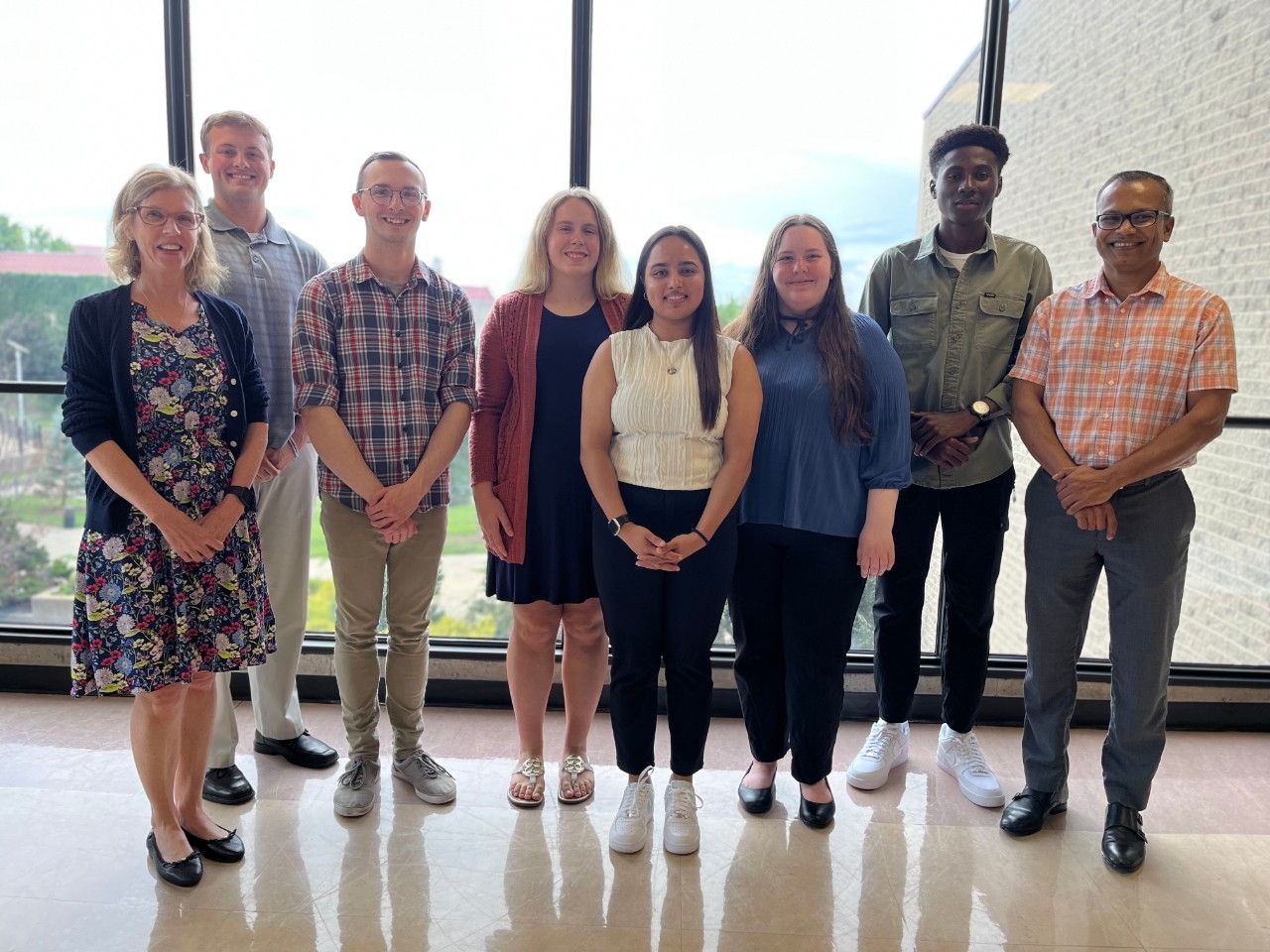 Undergraduate Research in STEM at NKU NKU Mathematics and Statistics faculty and student researchers smiling for the camera after their final summer research presentation with a community partner