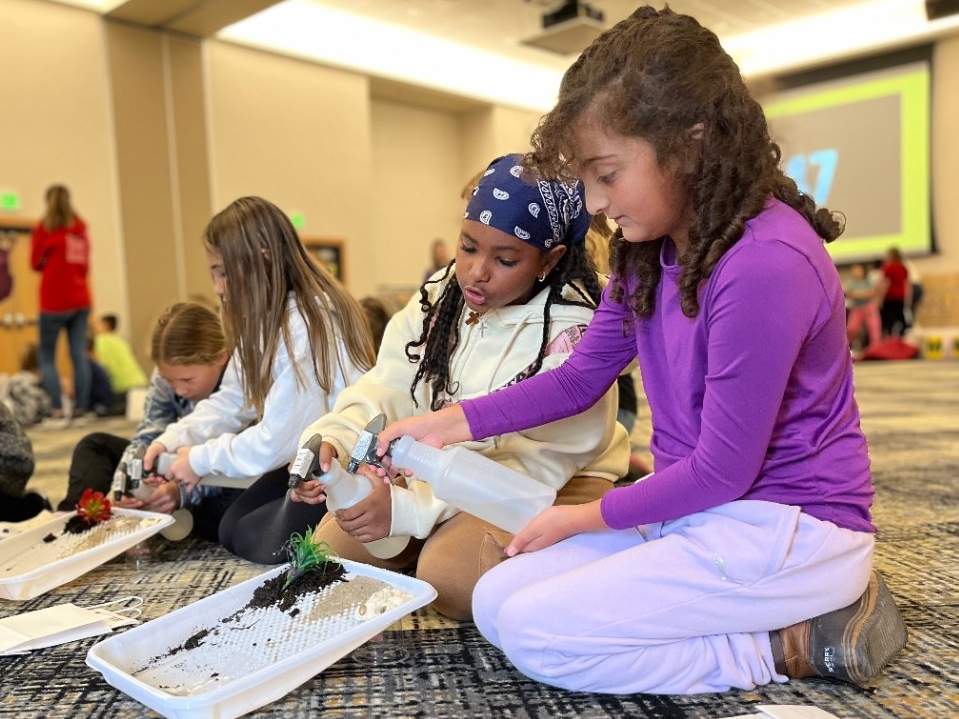 Local 4th grade students doing hands-on STEM lessons led by NKU Education and STEM majors.