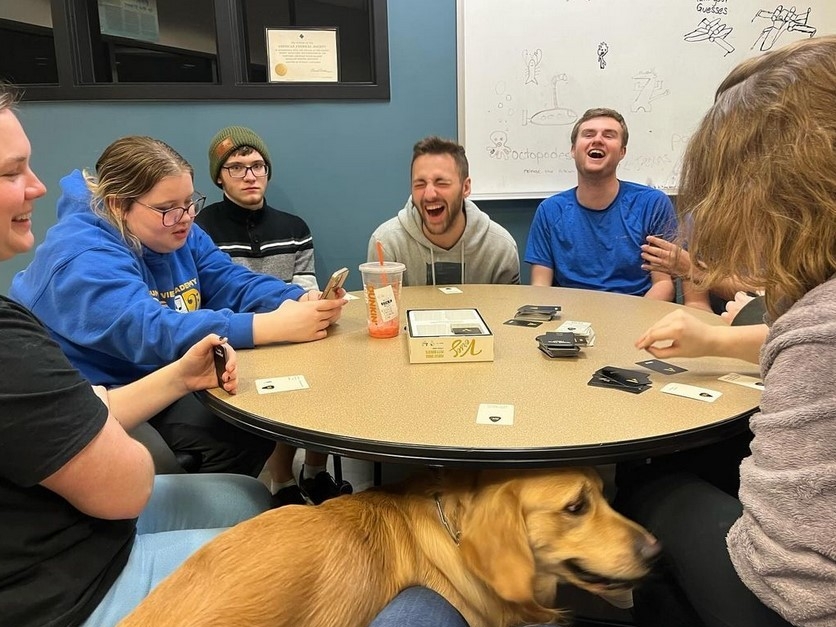SAACS members laughing and having a good time at a club event.