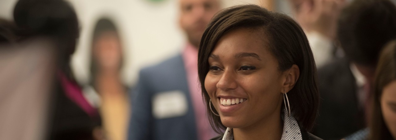 Smiling professional woman at career fair
