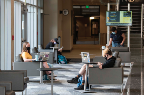 Students working on laptops inside the NKU Student Union