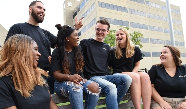 Woman studying on set of stairs