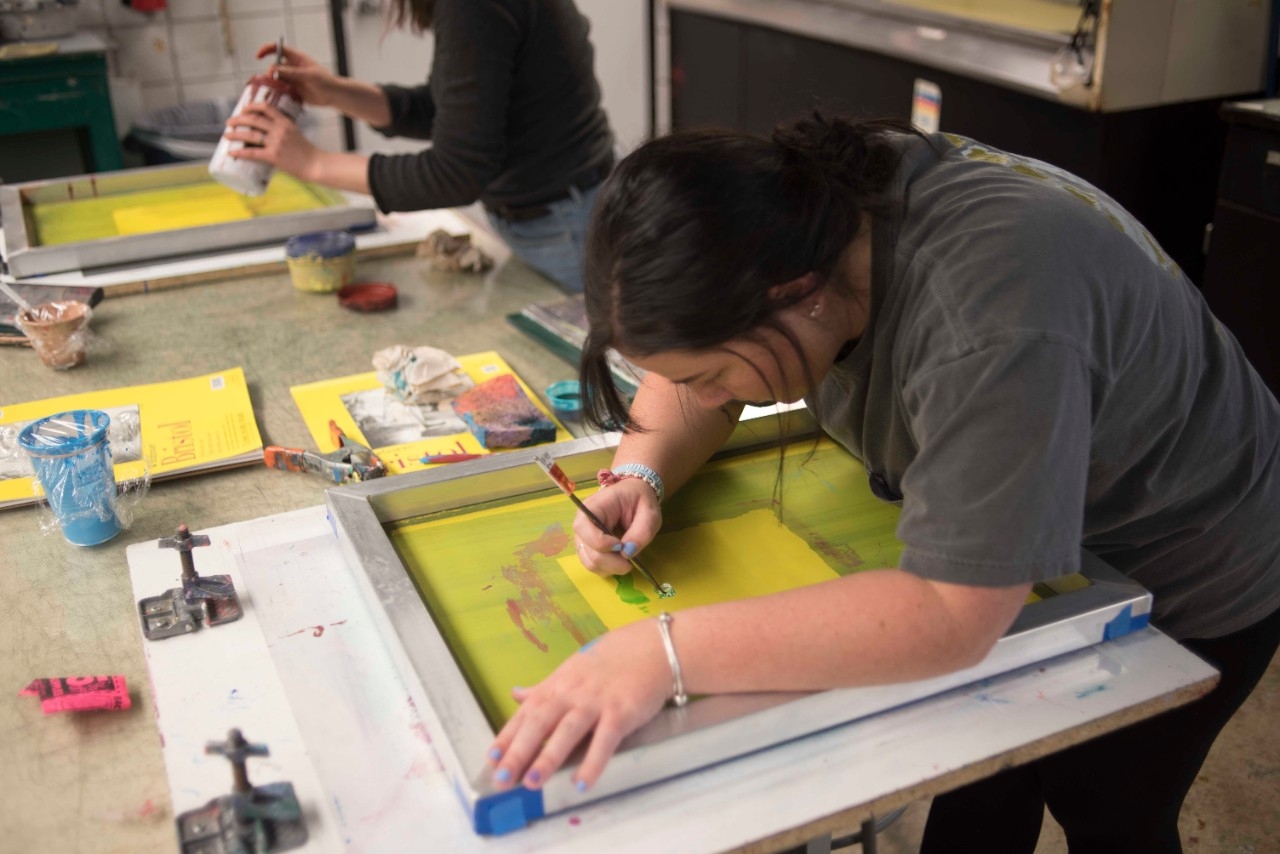Student working on painting