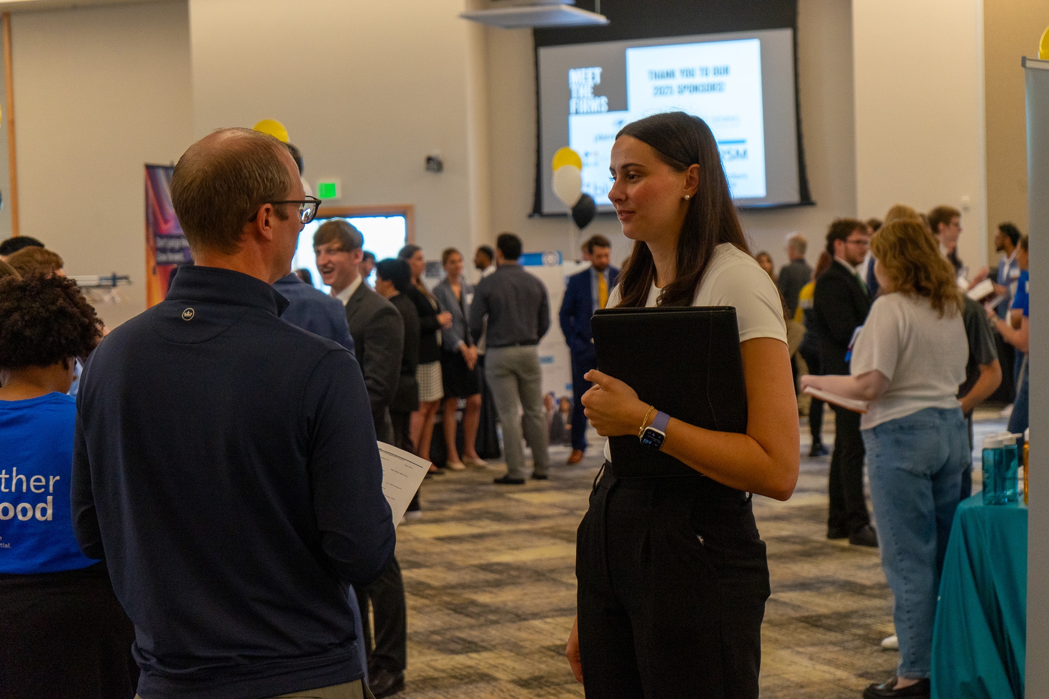  a young accounting student meets with a recruiter to find a job